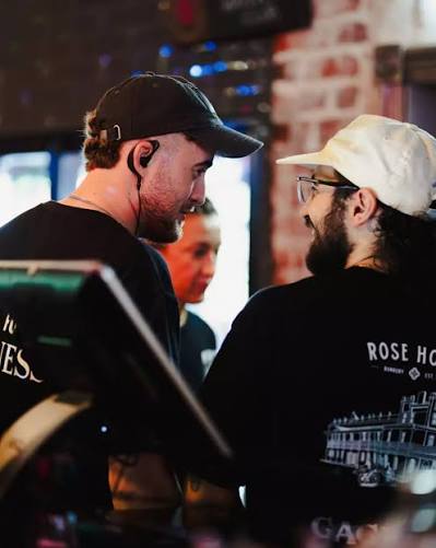 Ty, founder of South West Web Co., at work behind the bar